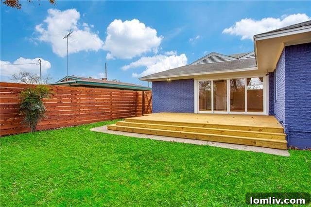 View of the home's side, showing the well-maintained yard and seamless integration with the outdoor spaces