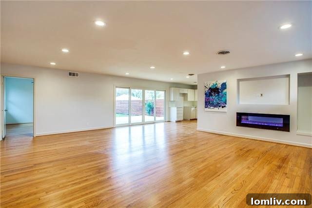 Spacious primary bedroom with refinished hardwood floors and ample natural light at 10208 San Lorenzo Drive