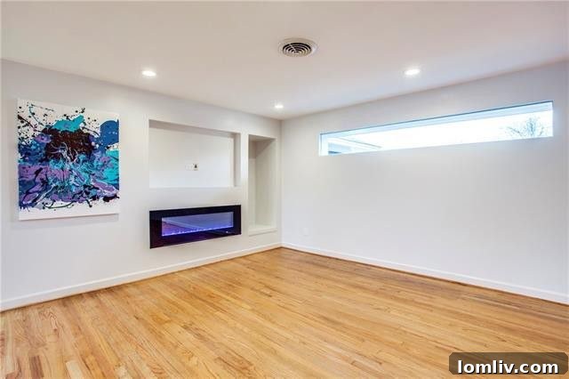 Third bedroom with rich hardwood flooring, ready for personalization at 10208 San Lorenzo Drive