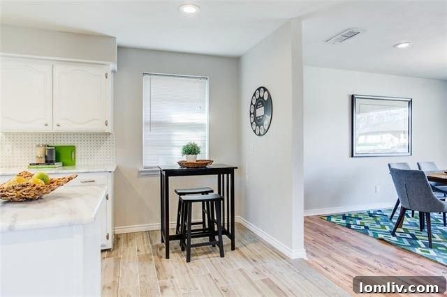 Stainless Steel Gas Range and Modern Hood in Renovated Kitchen