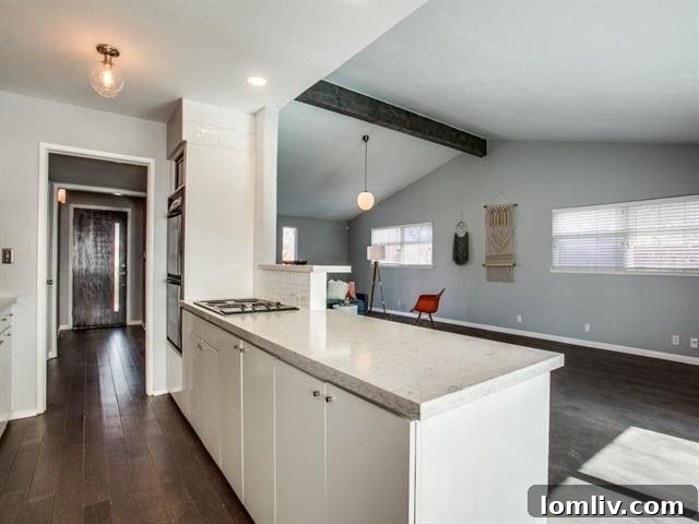 Kitchen Detail with Stainless Steel Double Ovens and Backsplash