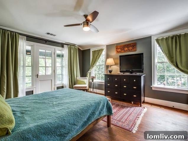 Spacious master bedroom with access to a private balcony, offering a serene retreat