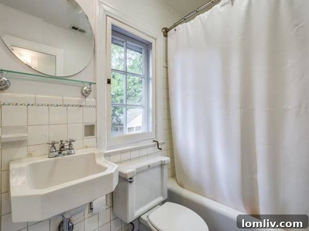 Guest bathroom with classic tile work and fixtures, blending historic charm with practicality