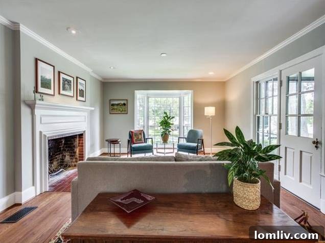 Interior view of the elegant foyer with gleaming hardwood floors and warm gray walls