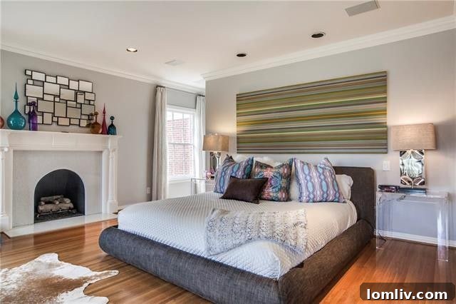Luxurious master bedroom with a comforting fireplace and ample space