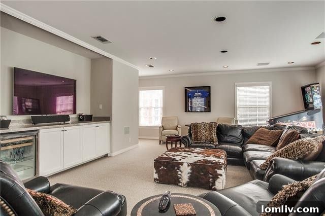 Upstairs media room with custom built-ins and a built-in beverage cooler