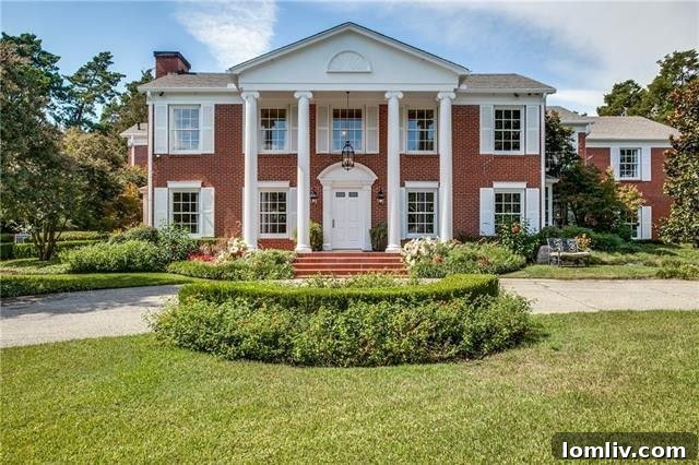 Classic southern mansion architecture with elegant columns and red brick