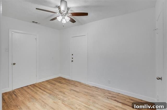 Refinished hardwood floors inside a unit of the 5702 Victor St eight-plex
