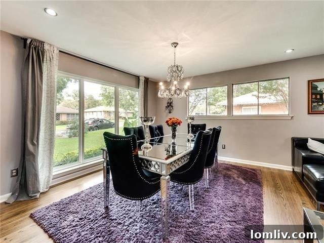 Dining Area Adjacent to Kitchen with Contemporary Lighting
