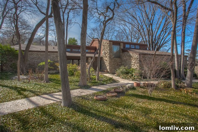 Soft contemporary home at 1000 Hidden Road, nestled among mature trees