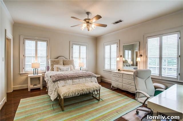A secondary bedroom, comfortably appointed and filled with natural light.