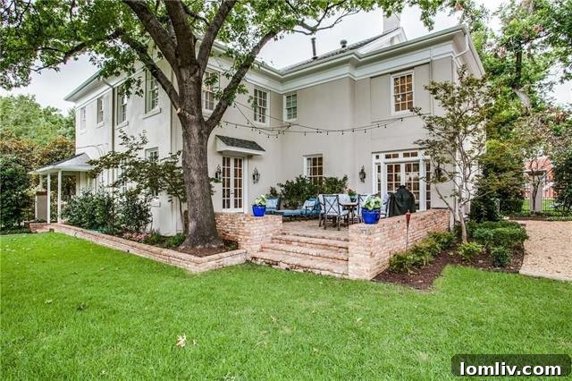 The exterior of the home, showcasing its well-manicured landscaping.