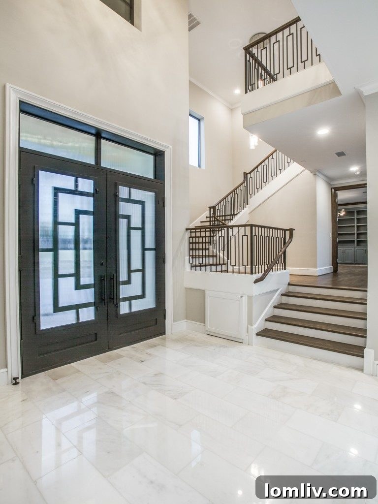 Spacious Great Room with Soaring 23-Foot Ceilings and Modern Chandelier in Dallas Home