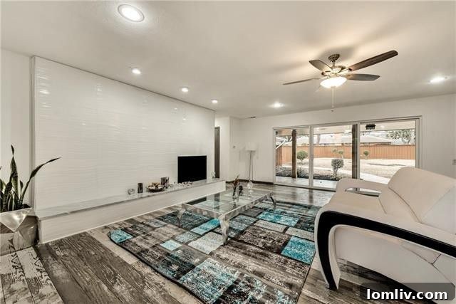 Three Stunning Dallas Open Houses 14 Open concept living room with modern fireplace and exotic barn floors at 1535 Acapulco Dr
