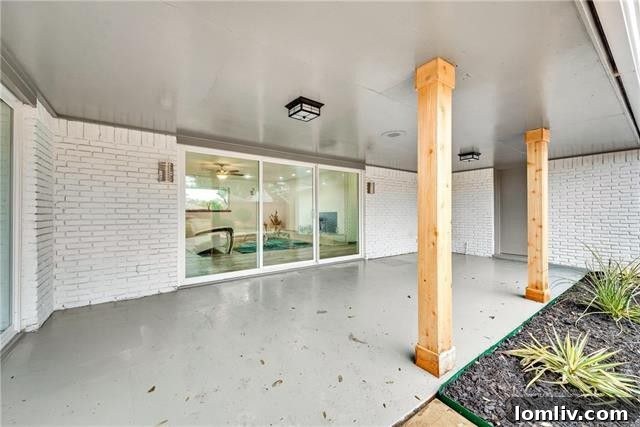 Spacious covered patio and backyard with modern privacy fence at 1535 Acapulco Dr