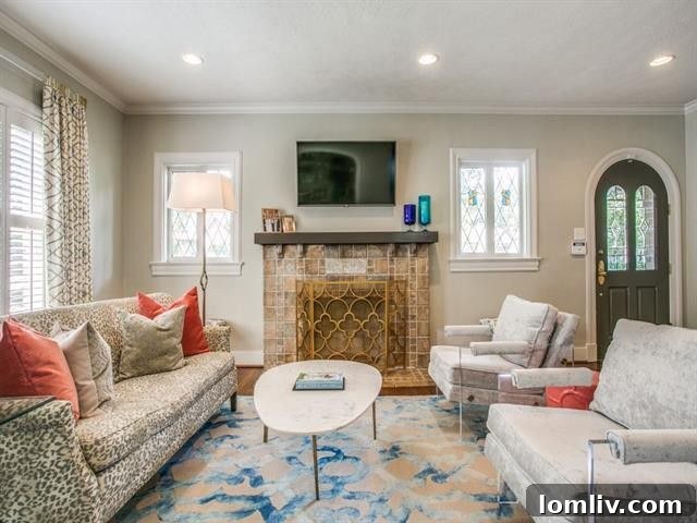 Three Stunning Dallas Open Houses 9 Elegant living room with original fireplace and arched doorway at 5510 Monticello Ave
