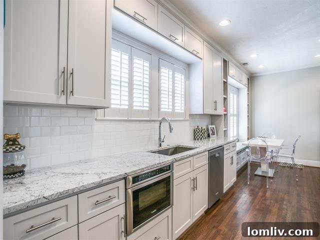 Three Stunning Dallas Open Houses 10 Renovated kitchen with Carrera Marble countertops and custom cabinets in M-Streets Tudor