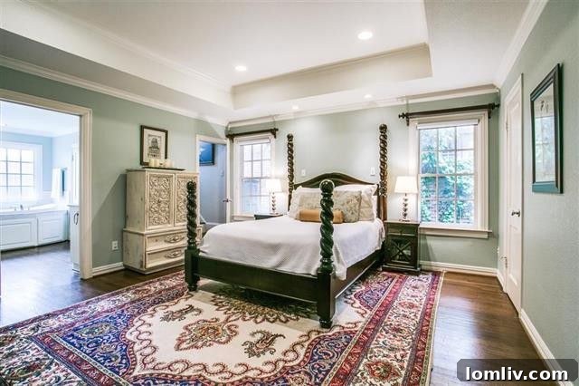Cozy family room with a stone fireplace and high ceilings.
