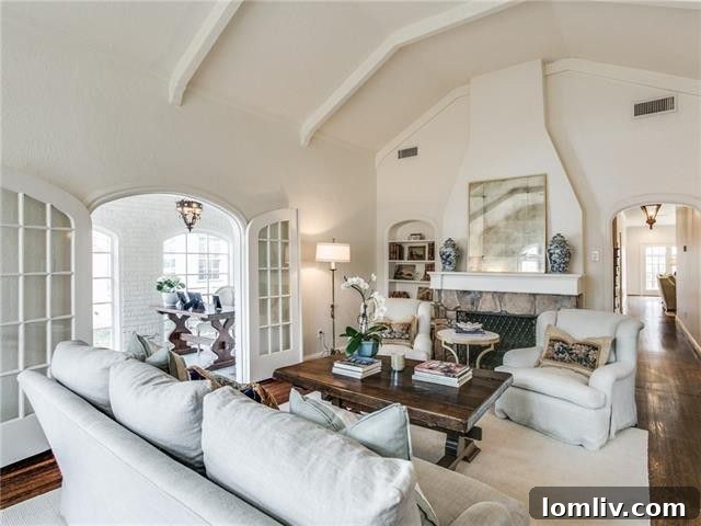 Spacious kitchen with marble countertops, stainless steel appliances, and custom cabinetry.
