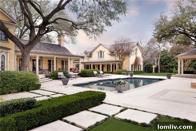 Manicured gardens and classic landscaping surrounding the Highland Park mansion