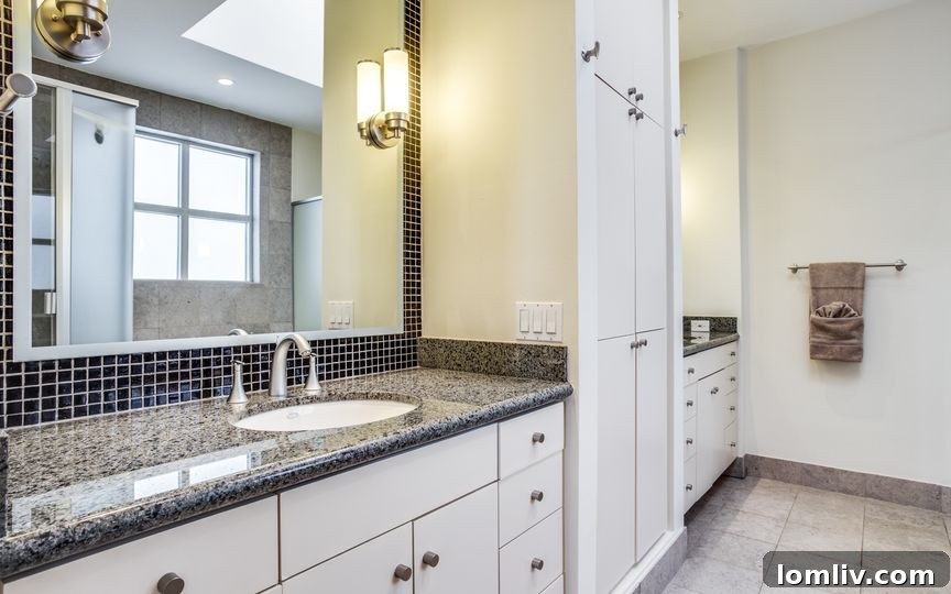 Luxurious Master Bathroom with Dual Vanities and Modern Fixtures
