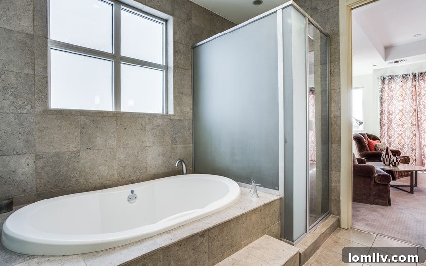 Elegant En-Suite Bathroom with Walk-in Shower and Garden Tub