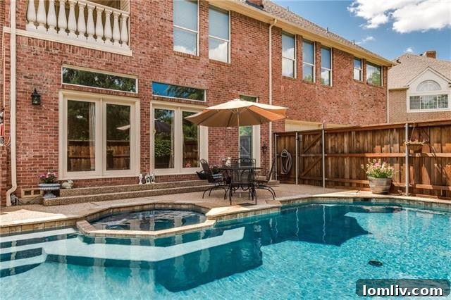 Stately brick exterior of 600 Ginkgo Circle, a premier luxury home in Las Colinas' Hackberry Creek