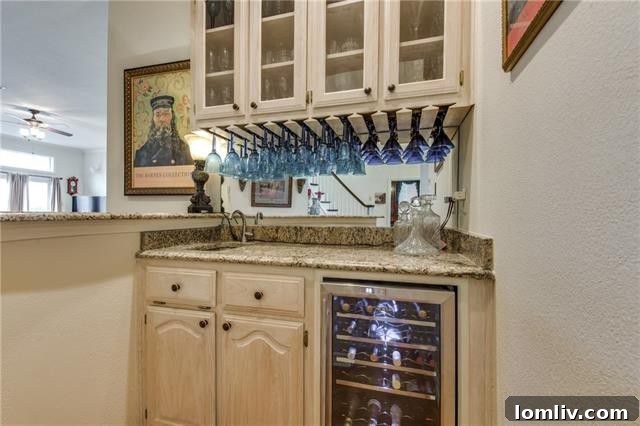 Expansive kitchen island with ample workspace, custom cabinetry, and modern lighting