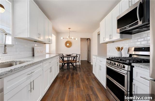 Renovated Galley Kitchen with White Cabinets