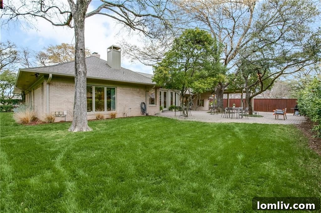 Another view of the beautifully landscaped half-acre lot in Russwood Acres