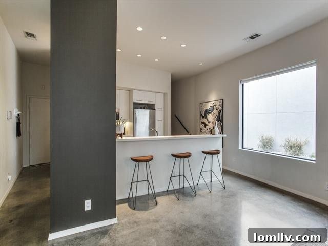 Spacious living area with abundant natural light and modern furnishings