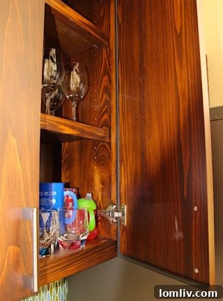 Detailed interior view of custom outdoor kitchen cabinetry with weatherstripping