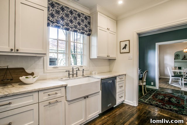 Hollywood Heights Tudor: A Designer's Vision Realized 16 Spacious kitchen view at 707 Cordova, featuring an island and ample counter space for entertaining.
