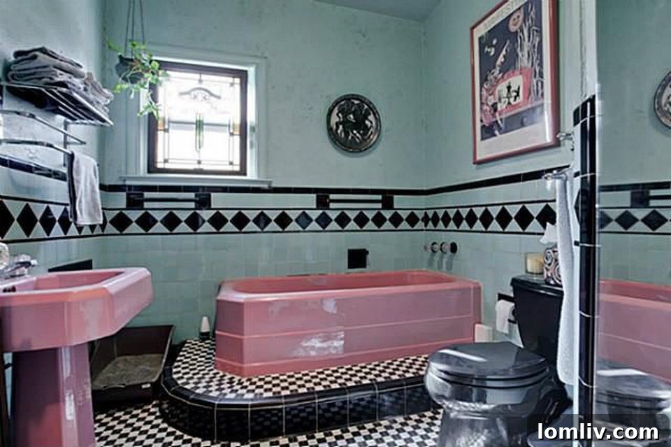 Hollywood Heights Tudor: A Designer's Vision Realized 25 Vintage bathtub preserved in the renovated master bathroom, blending historic charm with modern updates.