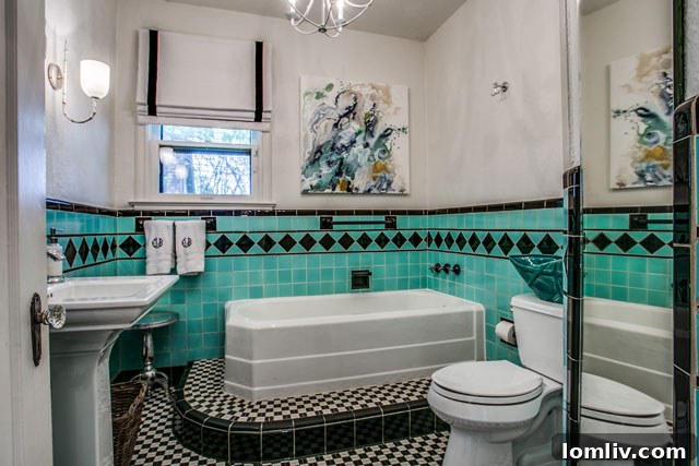 Hollywood Heights Tudor: A Designer's Vision Realized 26 Luxurious master bathroom with a vintage clawfoot tub and contemporary fixtures, epitomizing the blend of old and new at 707 Cordova.