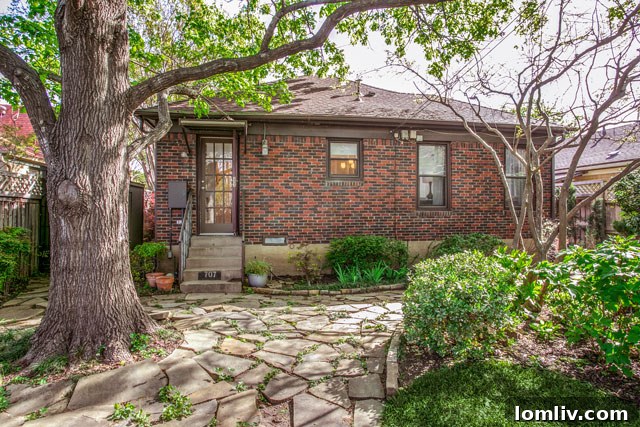 Hollywood Heights Tudor: A Designer's Vision Realized 29 Inviting front porch and entrance of the Hollywood Heights Tudor, highlighting its architectural beauty.