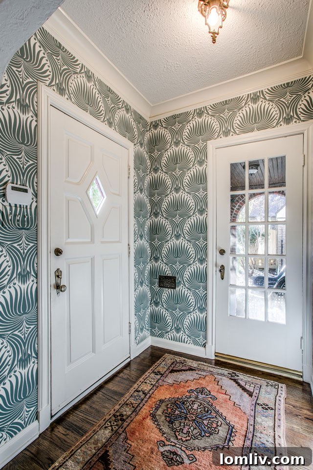 Hollywood Heights Tudor: A Designer's Vision Realized 4 Renovated entryway of 707 Cordova Street, now bright, inviting, and harmoniously blending modern touches with preserved historic details.