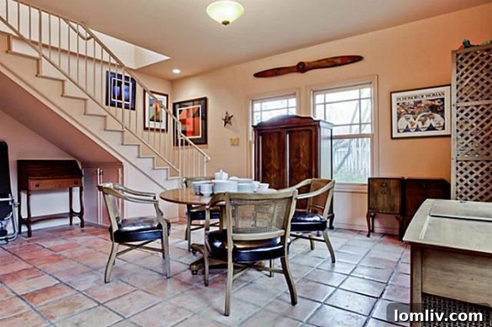 Hollywood Heights Tudor: A Designer's Vision Realized 31 Charming guest cottage exterior, offering additional living or working space.