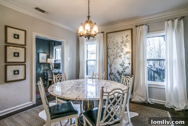 Hollywood Heights Tudor: A Designer's Vision Realized 10 Transformed dining room at 707 Cordova Street, now featuring a bright, airy ambiance with modern lighting and tasteful decor.