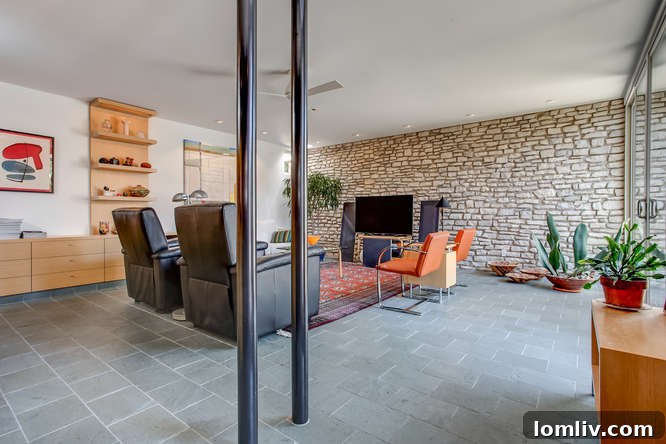 Restored stacked stone wall in the renovated mid-century modern townhome