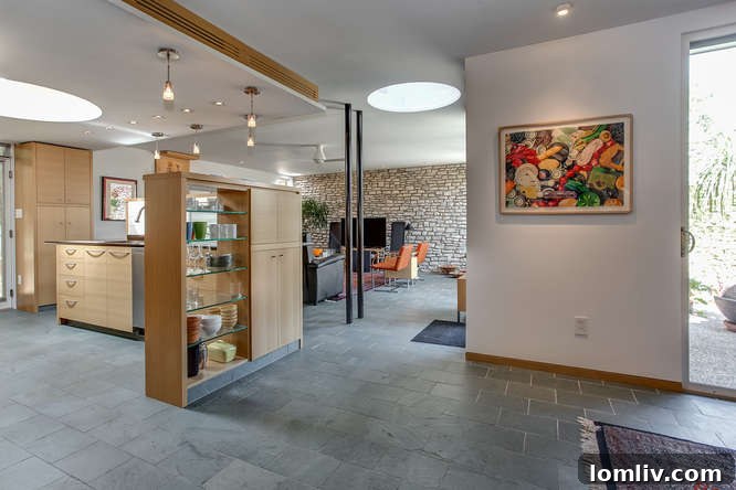 Vermont unfading green slate floors cover 80 percent of this eco-friendly townhome