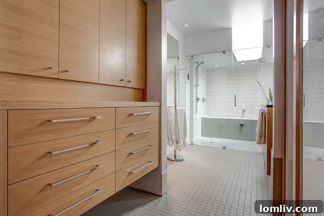Custom cabinetry and intelligent storage solutions throughout a contemporary green townhome