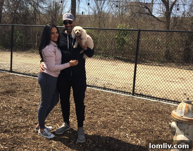 Michelle and Brent Johnson with their dog Cupcake enjoying the dog park at Merion at Midtown Park