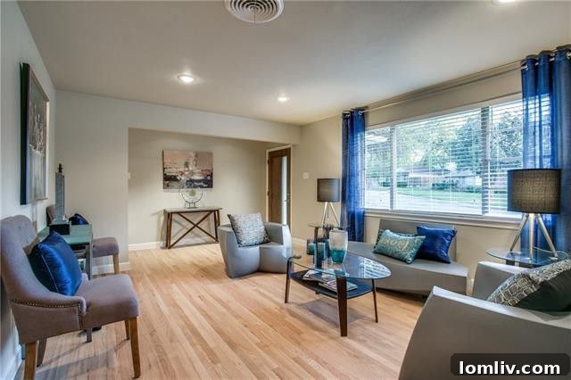 Sleek, modern living area with solid oak hardwoods in the Claremont Park renovation