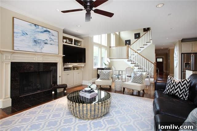 Inviting living room with a fireplace and built-ins in the Ridgewood Park Craftsman house