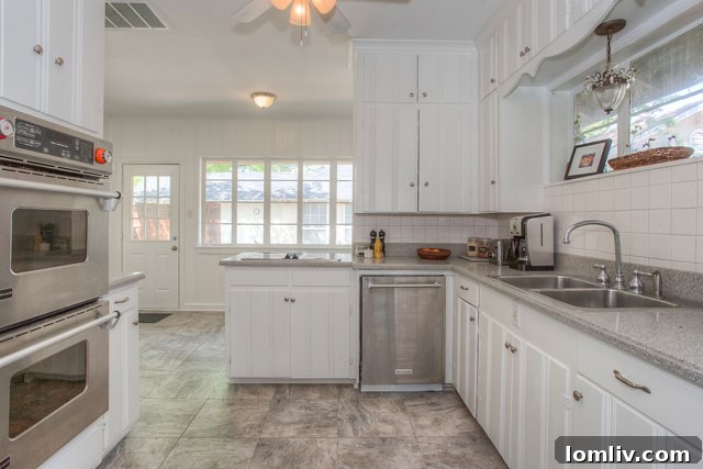 Spacious kitchen with double ovens and ample counter space in the 2718 Cockrell Avenue bungalow