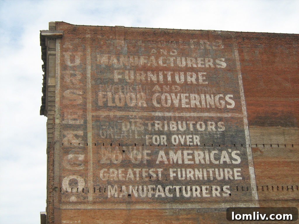 The faded 'ghost' sign of the Purse Building on 601 Elm Street, which inspired its enduring name, according to developer Tanya Ragan.