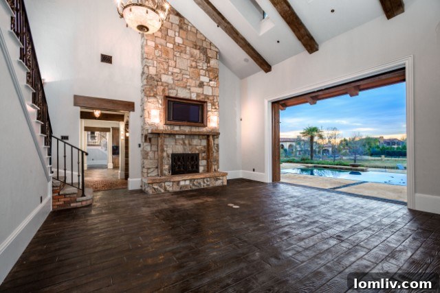 Main living area with fully retracting glass door opening to the outdoor patio