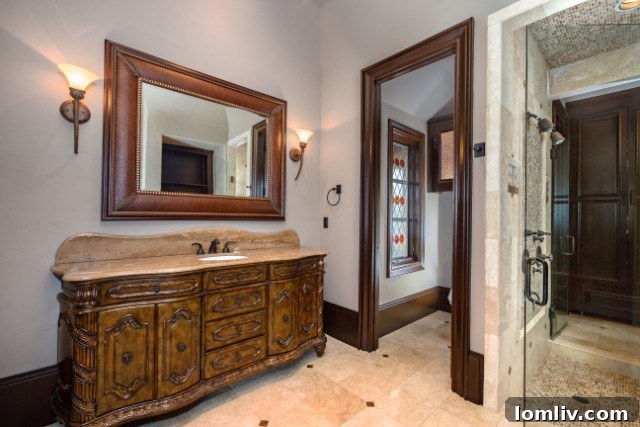 Another view of the master bathroom, highlighting ample space and premium finishes