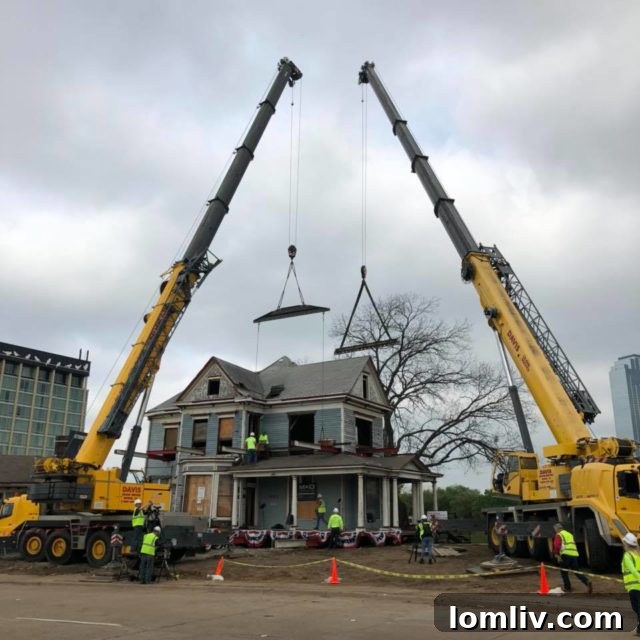 The Blue House, a magnificent Victorian Queen Anne mansion, being carefully moved through the streets of Dallas to its new home.
